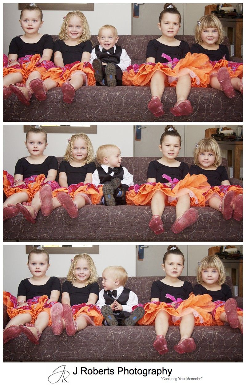 Flower girls and paige boy all lined up on a couch - sydney wedding photography with kids
